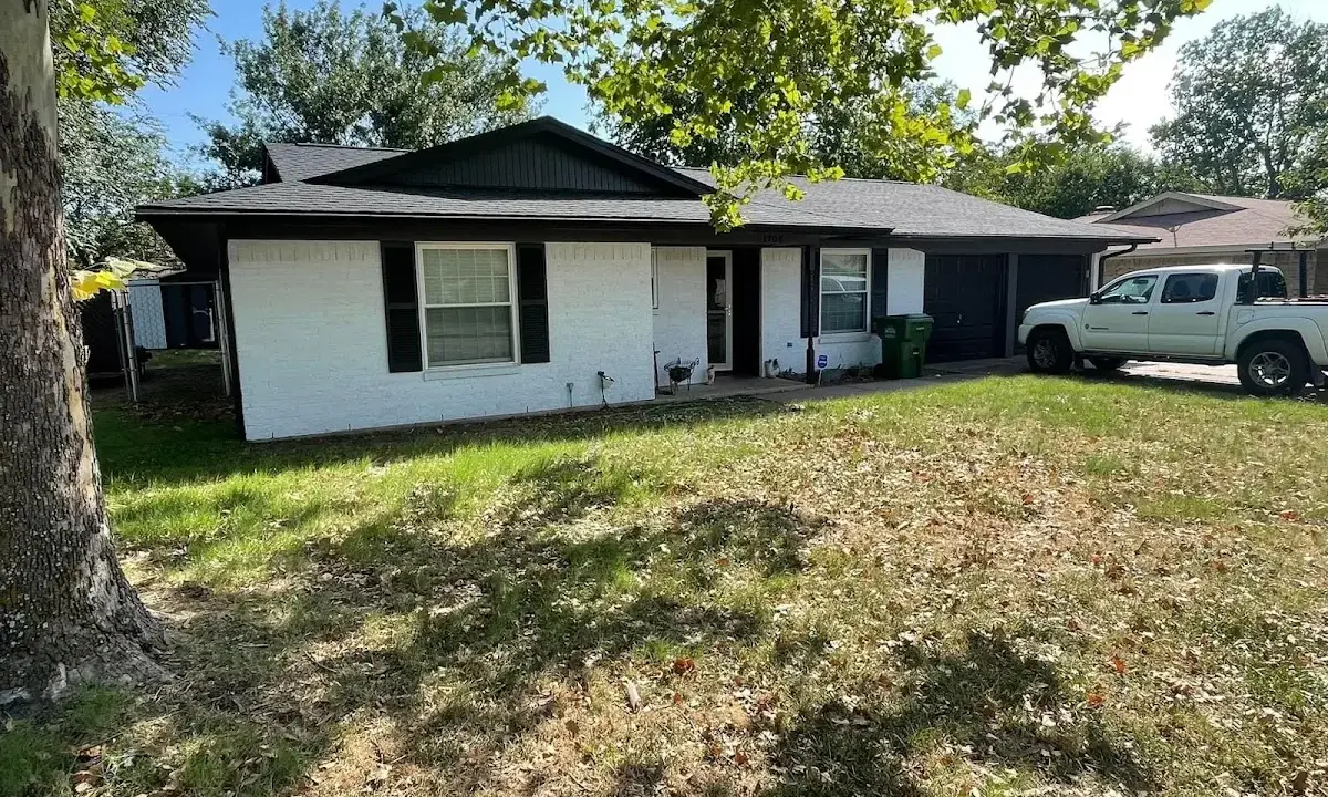 Professional roofing crew working on a residential roof in Bellbrook